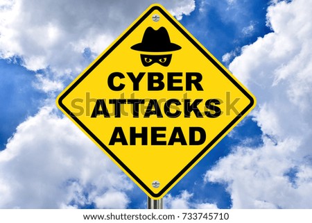 Cyber Attacks Ahead, yellow caution sign on sky back drop. 