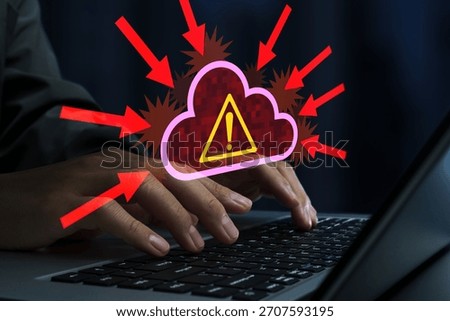 Cyber attacks on cloud servers. DDoS attack and cloud service disruption. Hacker using laptop computer.