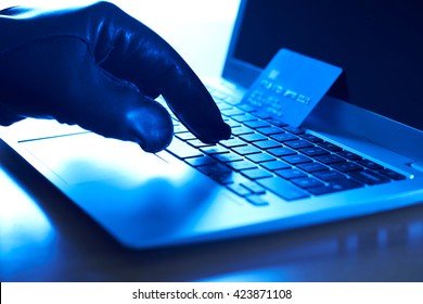 Cyber Criminal With Stolen Credit Card And Laptop