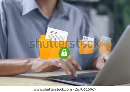 Cyber data security with secure online file protection, Online file server protection system with folder and lock. Person working with security system for safe personal information storage.