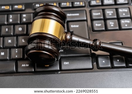 Cyber law or justice concept, judge gavel on computer keyboard