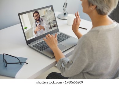 Cyber Medicine. Mature Lady Talking To Doctor Online From Home. Medical Specialist Consulting Senior Patient On Webcam