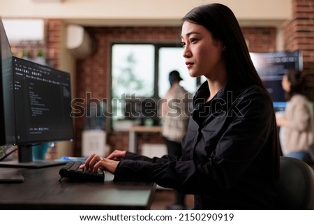 Cyber officer encrypting big chunks of data in order to secure important files. Software developer engineering an autonomous defence system using advanced artificial intelligence technology.