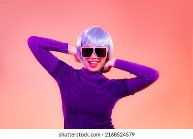 Cyber Punk Girl Concept, Asian Woman In Purple Sweatshirt Silver And Blue Short Hair Style Wearing Sunglasses Posing Like Robot. 