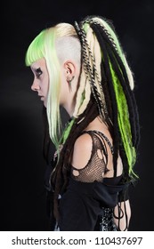 Cyber Punk Girl With Green Blond Hair And Red Eyes Isolated On Black Background. Expressive Face. Studio Shot.