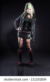 Cyber Punk Girl With Green Blond Hair And Red Eyes Isolated On Black Background. Expressive Face. Studio Shot.