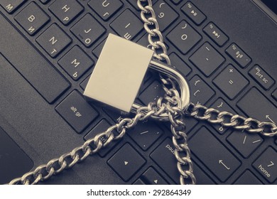 Cyber Safety Concept, Locked Chain On Laptop Computer Keyboard