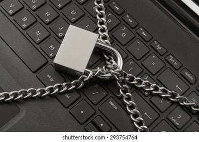 Cyber Safety Concept, Locked Chain On Laptop Computer Keyboard