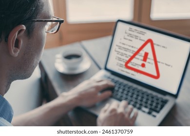 Cyber security alert concept. System hacked warning alert due to hacker attack on computer network. Internet virus cybersecurity and cybercrime. Critical error sign on blurred screen. - Powered by Shutterstock