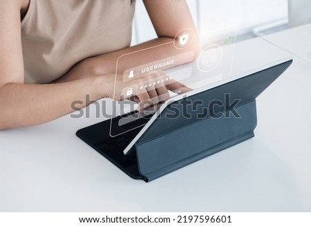 Cyber security with biometrics authentication technology concept. Safety shield with finger scan icon on log in page virtual on tablet computer screen for validate password, Identity verification. 