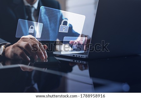 Cyber security, Business, technology, internet network, software development, digital data protection concept. Businessman working on laptop computer in office with pop up antivirus system