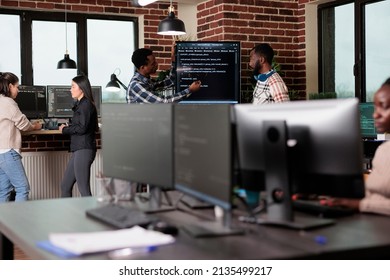 Cyber Security Company Developers Encrypting Cloud Processing Data System Using Blockchain Technology. Cybernetics Engineers Reviewing Lines Of Code In Order To Secure Mainframe Database Storage.