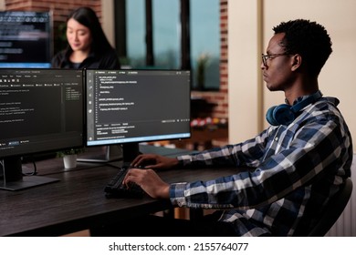 Cyber security company employee developing blockchain based database processing system. Cybernetic officer coding a machine learning software to protect mainframe encrypted files. - Shutterstock ID 2155764077