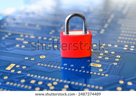 Cyber security concept background - red padlock on blue computer motherboard circuit board background