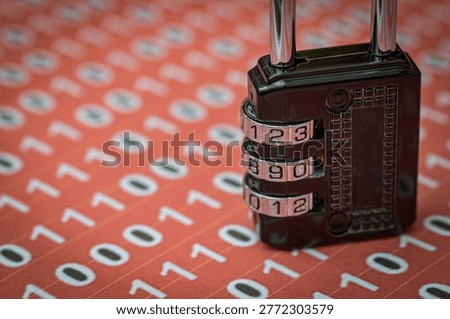 Cyber security concept with combination padlock on red binary code background.