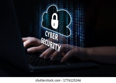 Cyber security concept. Hacker using laptop, closeup. Cloud with padlock illustration over keyboard