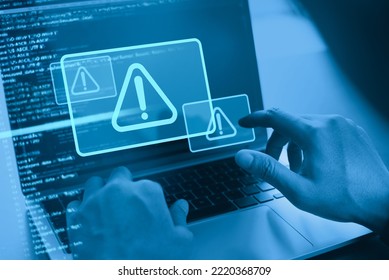 Cyber security concept. Man using computer with system hacked alert due to cyber attack on computer network. Data Protection. Internet virus cyber security and cybercrime