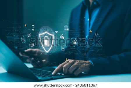 Cyber security data protection concept. Professional using a laptop with virtual protective shield, depicting online data security and cyber protection. Encryption privacy, Personal information access
