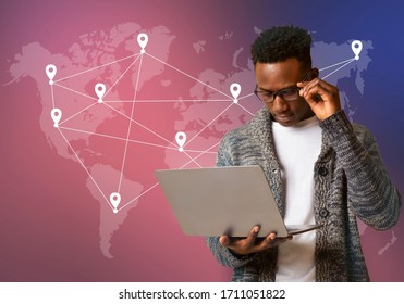 Cyber Security Global Network Concept. African American Hacker In Glasses Using Laptop On World Map Background With Point Mark