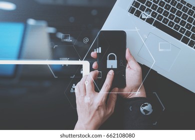 Cyber Security Internet And Networking Concept.Businessman Hand Working With VR Screen Padlock Icon Mobile Phone On Laptop Computer And Digital Tablet