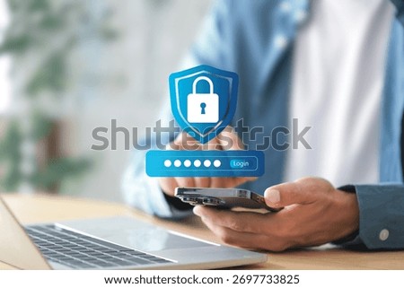 Cyber security login interface concept , Businessman using mobile phone to log in securely with user interface screen data protection, privacy, authentication, and online security.