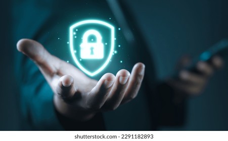 Cyber security network. Businessman holding Padlock shield icon and internet technology networking and protecting data personal information. privacy security. Data protection privacy concept. GDPR. EU - Shutterstock ID 2291182893