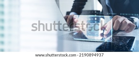 Cyber security network. Businessman using laptop and tablet with digital padlock for personal data protection on internet technology networking and social network, computer antivirus software update