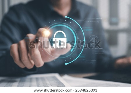Cyber security system technology. Secure information privacy. Crime network technology. A man is pointing at a blue circle with a padlock on it. The padlock is glowing.