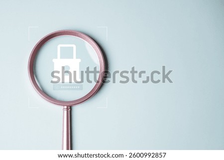 Cyber security system technology. Secure information privacy. Crime network technology. A magnifying glass is used to look at a picture of a lock. The lock is on a website.