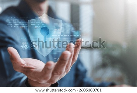 Cyber security system technology. Secure information privacy. Crime network technology. A person is holding a key in their hand, and it is displayed on a computer screen. The key is blue.