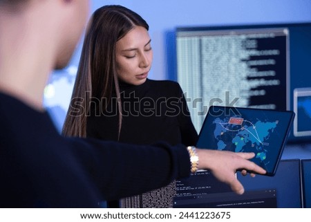 Cyber security team working in a Cyber Security Operations Center SOC to protect systems and technologies