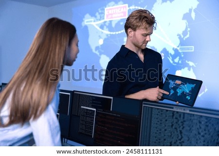 Cyber security team working in a Cyber Security Operations Center SOC to protect systems and technologies