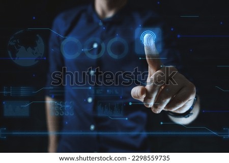 Cyber security technology concept. Man points finger at finger print scan. High quality photo