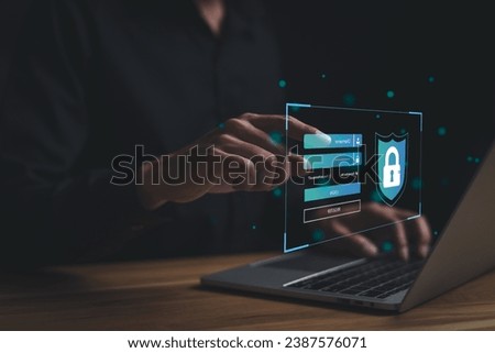 Cyber security technology concept. Man trying to screen access information using Username and password with laptop. Computer security system, Privacy protection. Protecting secrets from fake people.
