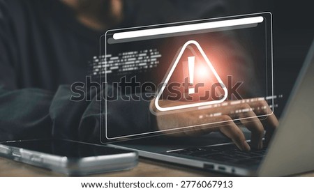Cyber security warning alert on smartphone and laptop screen. Online scam, phishing attack, data breach risk, and digital threat protection for secure internet usage and information safety.
