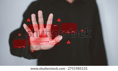 Cyber security warning concept showing hand interacting with digital alert interface and warning icons, representing online threats, internet security risks, content moderation and cyber protection systems.
