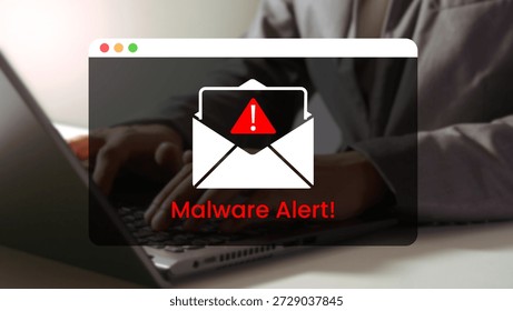 Cyber Threat Notification: A computer user faces a stark warning with a Malware Alert popup notification on their laptop screen, highlighting the dangers of online security and digital threats.