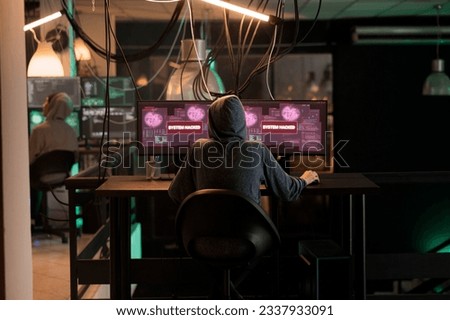 Cyberattack, criminal hacking computer program password, stealing data, sending virus, breaking into database server. Cybercrime, privacy information leak, internet criminal coding spyware, back view