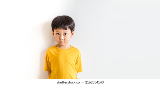Cyberbullying Low self esteem.Asian kid boy child feeling sad.Autism kid with bad comments and hate speech.Mental health.Bully, Anxiety health, Social media harassment.Emotional Tantrum and Angry boy. - Shutterstock ID 2162334143