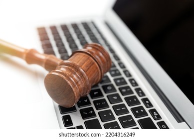 Cybercrime Concept With Gavel On Laptop. Law And Justice.