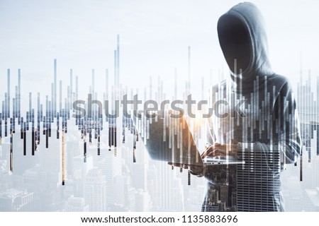 cybercrime, hacking and technology crime. double exposure with no face hacker with laptop and financial chart.