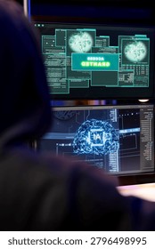 Cybercriminal coding on PC getting access granted message, evading security with stealth malware while evil man successfully making script hiding malicious code from detection systems.