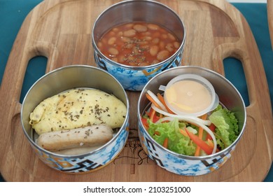 Cyberjaya, Malaysia 1 Jan 2022: Lunch Box Or Tiffin Made Up Of Stainless Steel For Office Or Workplace, Includes Baked Bean, Omelet, And Vegetables.  