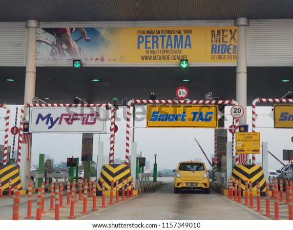 Cyberjaya, Malaysia. August 15, 2018. Maju Expressway is\
one of the highway concession in Malaysia implementing new toll\
system using radio frequency identification or RFID in its\' toll\
booth 
