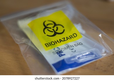 Cyberjaya, Malaysia - November 21, 2021: The Latest Covid 19 Spit Test Or Quick Test. Public Places Are Only Allowed If The Visitor Do A Corona Self Test. After Use The Bag Is Classified  Biohazard