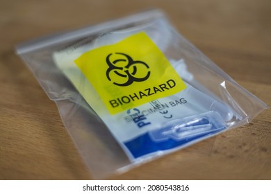 
Cyberjaya, Malaysia - November 21, 2021: The Latest Covid 19 Spit Test Or Quick Test. Public Places Are Only Allowed If The Visitor Do A Corona Self Test. After Use The Bag Is Classified  Biohazard