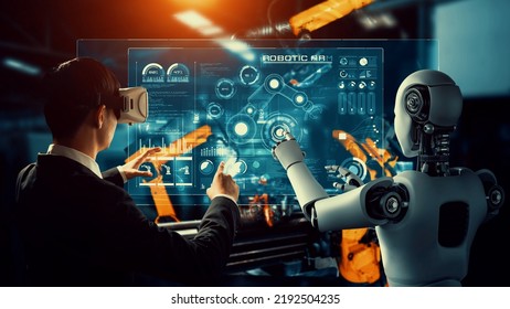 Cybernated industry robot and human worker working together in future factory . Concept of artificial intelligence for industrial revolution and automation manufacturing process . - Shutterstock ID 2192504235