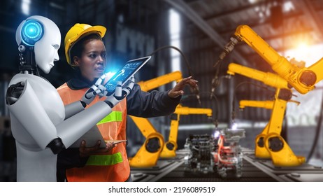 Cybernated industry robot and human worker working together in future factory . Concept of artificial intelligence for industrial revolution and automation manufacturing process . - Shutterstock ID 2196089519