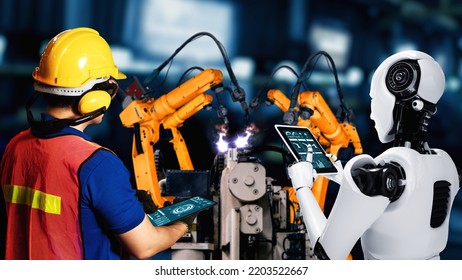 Cybernated industry robot and human worker working together in future factory . Concept of artificial intelligence for industrial revolution and automation manufacturing process . - Shutterstock ID 2203522667