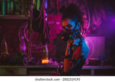 Cyberpunk Cosplay. A Girl In A Gas Mask In A Post-apocalyptic Style With Neon Lighting